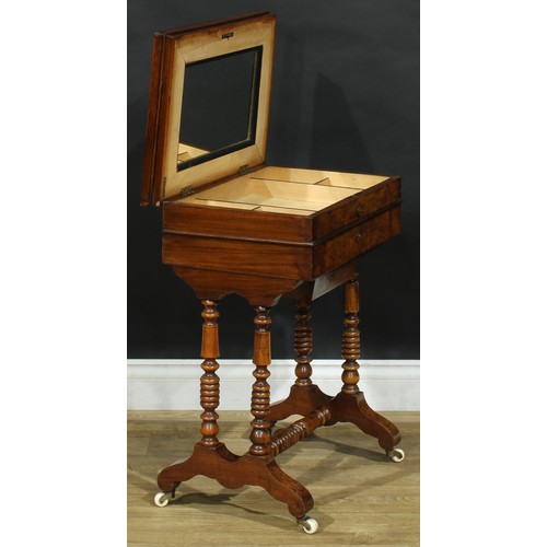 1835 - A late 19th century walnut work table, hinged top enclosing a mirror and compartmented interior abov... 