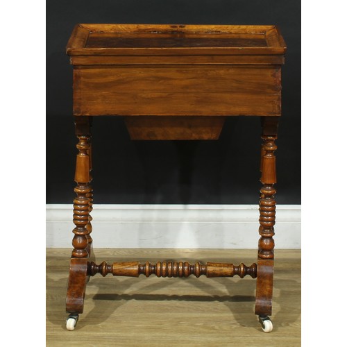 1835 - A late 19th century walnut work table, hinged top enclosing a mirror and compartmented interior abov... 