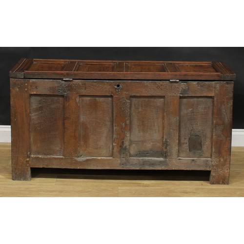 2156 - A late 17th century oak blanket chest, hinged top above a frieze carved with scrolling stylised leav... 