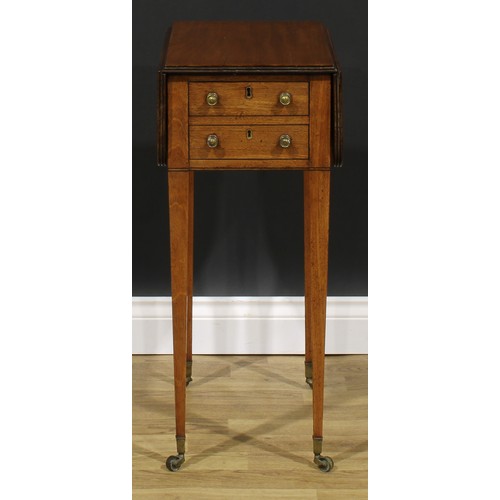 2365 - A Regency mahogany work table, rounded rectangular top with reeded edge and fall leaves above a fall... 