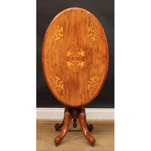 2213 - A Victorian walnut and marquetry centre table, of small proportions, oval tilting top, turned column... 