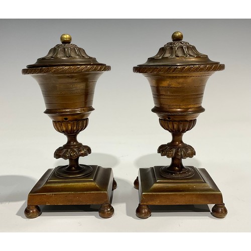 2091 - A pair of Regency bronze campana cassolettes, square bases, bun feet, 15cm high, c.1820