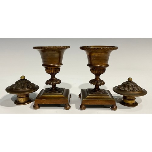 2091 - A pair of Regency bronze campana cassolettes, square bases, bun feet, 15cm high, c.1820