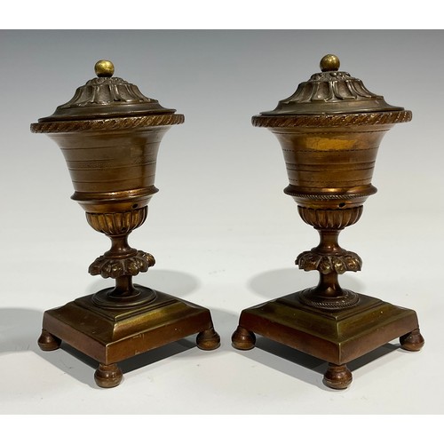 2091 - A pair of Regency bronze campana cassolettes, square bases, bun feet, 15cm high, c.1820