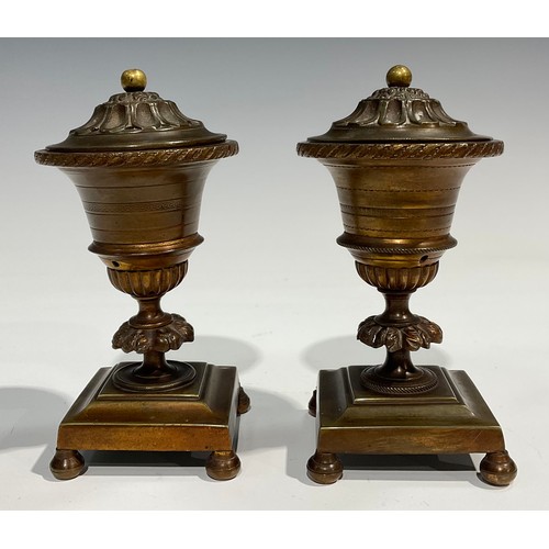 2091 - A pair of Regency bronze campana cassolettes, square bases, bun feet, 15cm high, c.1820