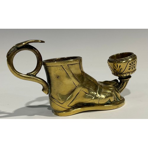 1804 - A late 19th century brass candlestick, in the Grand Tour manner, as a sandaled foot, with vesta hold... 