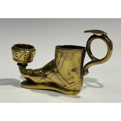 1804 - A late 19th century brass candlestick, in the Grand Tour manner, as a sandaled foot, with vesta hold... 