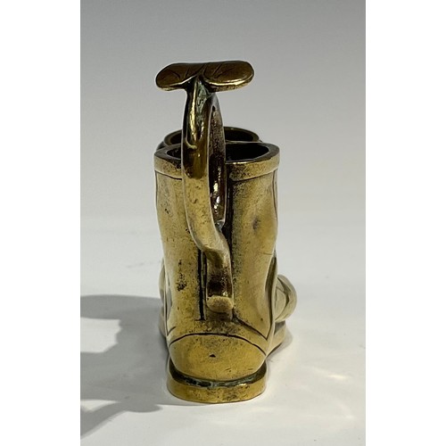 1804 - A late 19th century brass candlestick, in the Grand Tour manner, as a sandaled foot, with vesta hold... 