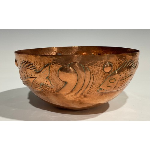 2345 - A Newlyn Arts & Crafts copper bowl, repousse embossed with a repetitive band of stylised fish, on a ... 