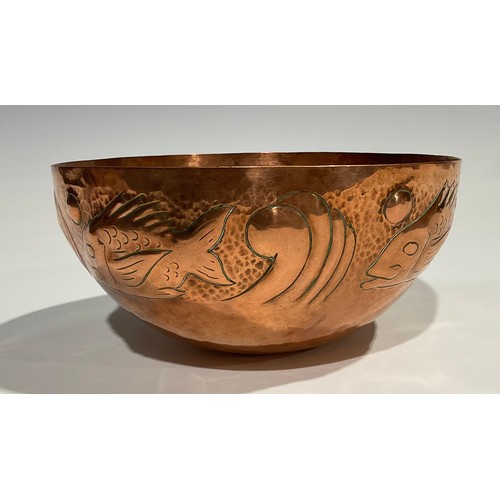 2345 - A Newlyn Arts & Crafts copper bowl, repousse embossed with a repetitive band of stylised fish, on a ... 