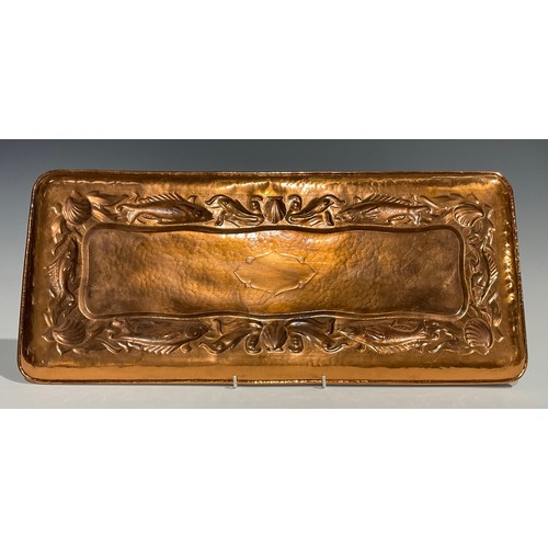 2347 - A Newlyn Arts & Crafts rounded rectangular copper tray, repousse embossed with a repetitive band of ... 