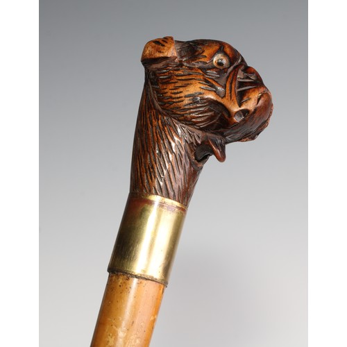 2505 - A late 19th century novelty automaton walking stick, the Black Forest type pommel carved as the head... 