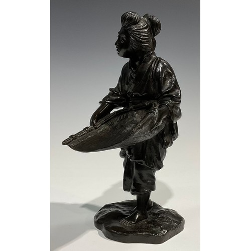 489 - Genryusai Seiya (Japanese School, Meiji Period), a brown patinated bronze, of a female holding rice ... 