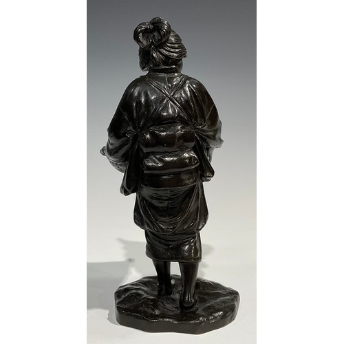 489 - Genryusai Seiya (Japanese School, Meiji Period), a brown patinated bronze, of a female holding rice ... 