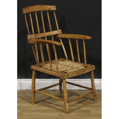 1611 - A 19th century Irish beech and ash hedge or famine chair, of traditional vernacular form, 96cm high,... 