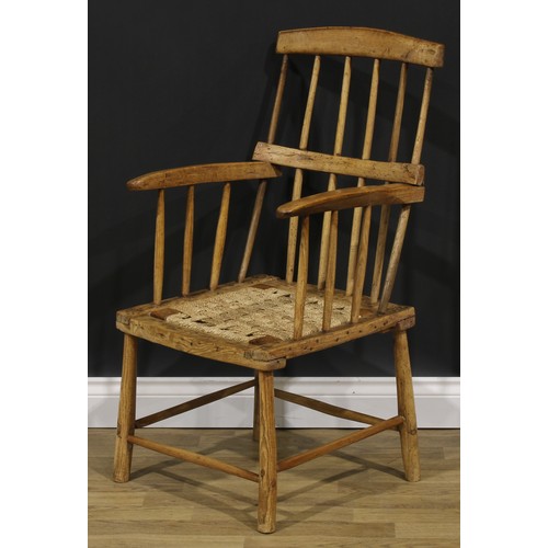 1611 - A 19th century Irish beech and ash hedge or famine chair, of traditional vernacular form, 96cm high,... 