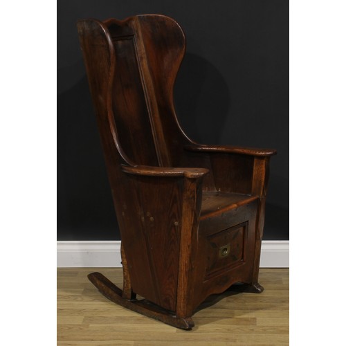 2330 - An early 19th century pine and indigenous timber lambing chair, probably Lancashire or Yorkshire and... 