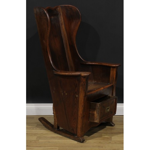 2330 - An early 19th century pine and indigenous timber lambing chair, probably Lancashire or Yorkshire and... 