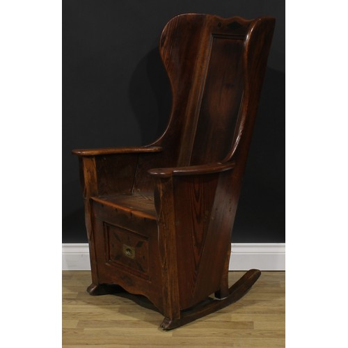 2330 - An early 19th century pine and indigenous timber lambing chair, probably Lancashire or Yorkshire and... 