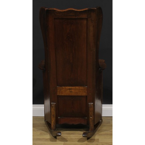 2330 - An early 19th century pine and indigenous timber lambing chair, probably Lancashire or Yorkshire and... 