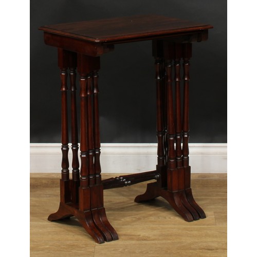 1857 - A nest of three William IV rosewood occasional tables, rounded rectangular tops, turned supports and... 