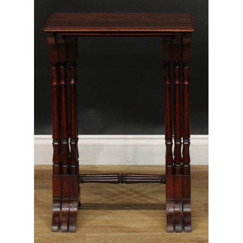 1857 - A nest of three William IV rosewood occasional tables, rounded rectangular tops, turned supports and... 