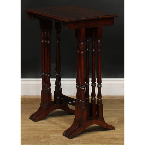 1857 - A nest of three William IV rosewood occasional tables, rounded rectangular tops, turned supports and... 