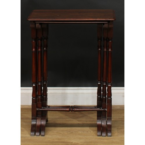 1857 - A nest of three William IV rosewood occasional tables, rounded rectangular tops, turned supports and... 