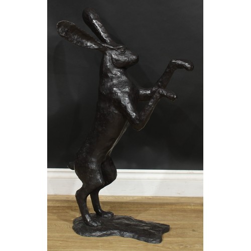 1764 - A pair of contemporary dark patinated bronze models, boxing hares, the largest 88.5cm high, the othe... 