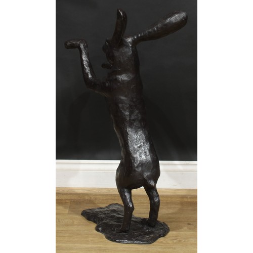 1764 - A pair of contemporary dark patinated bronze models, boxing hares, the largest 88.5cm high, the othe... 