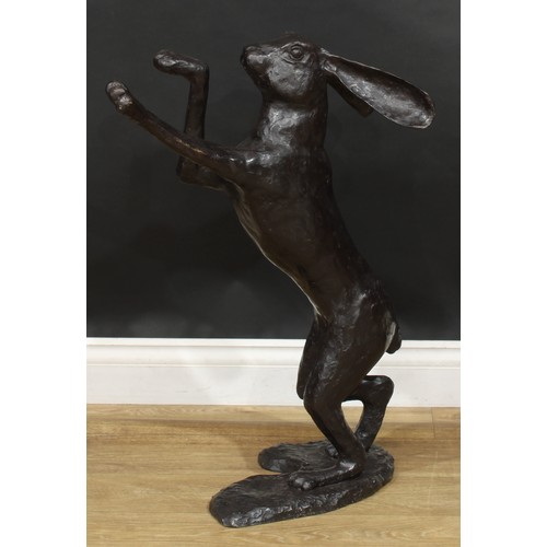 1764 - A pair of contemporary dark patinated bronze models, boxing hares, the largest 88.5cm high, the othe... 