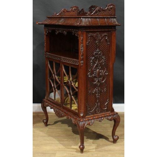 1647 - A Chinese Chippendale style mahogany pagoda-form display cabinet, rectangular top above a mirror-bac... 