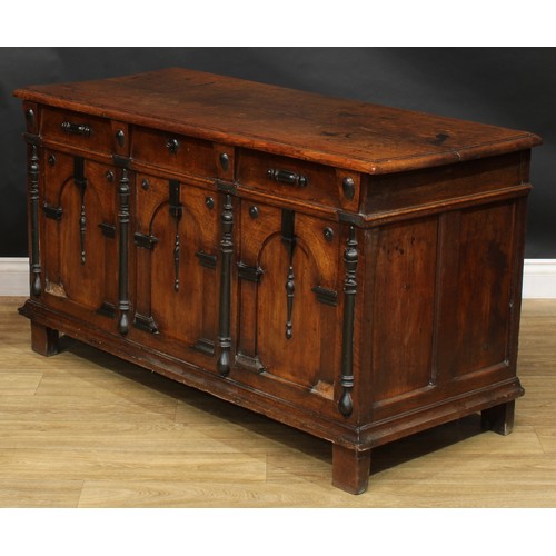 1999 - An 18th century oak and parcel-ebonised blanket chest, possibly Flemish, hinged top above a three pa... 