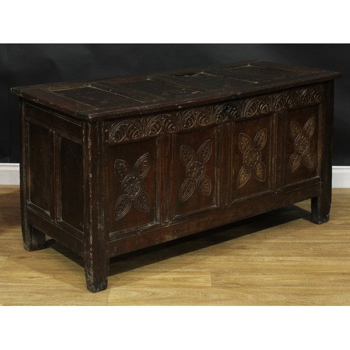 2000 - An 18th century oak blanket chest, hinged top enclosing an open till above a four panel front, the f... 