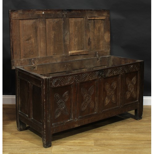 2000 - An 18th century oak blanket chest, hinged top enclosing an open till above a four panel front, the f... 