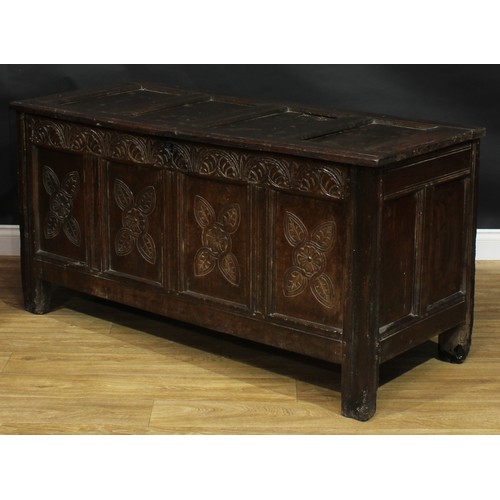 2000 - An 18th century oak blanket chest, hinged top enclosing an open till above a four panel front, the f... 