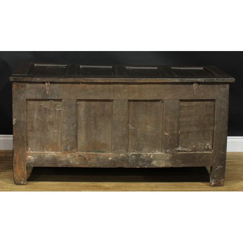 2000 - An 18th century oak blanket chest, hinged top enclosing an open till above a four panel front, the f... 