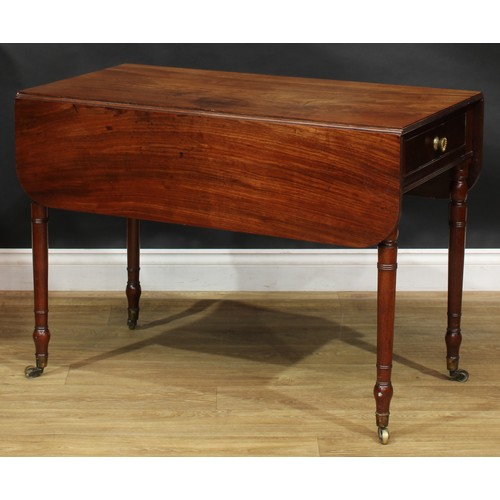 2360 - A Regency mahogany Pembroke table, rounded rectangular top with reeded edge and fall leaves above a ... 