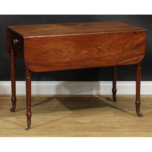 2360 - A Regency mahogany Pembroke table, rounded rectangular top with reeded edge and fall leaves above a ... 