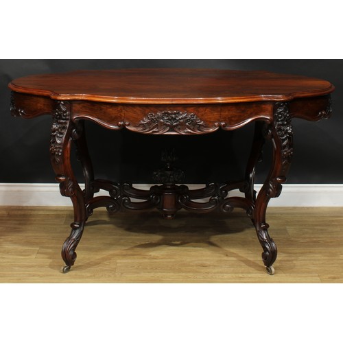 2598 - A Victorian rosewood centre table, serpentine oval top above a frieze drawer, the verso conforming, ... 