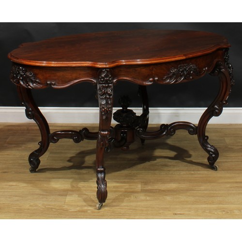 2598 - A Victorian rosewood centre table, serpentine oval top above a frieze drawer, the verso conforming, ... 