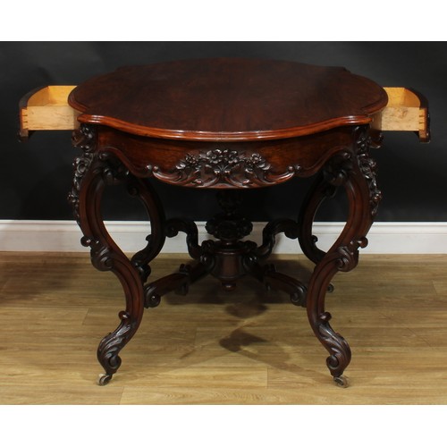 2598 - A Victorian rosewood centre table, serpentine oval top above a frieze drawer, the verso conforming, ... 