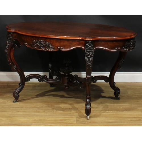 2598 - A Victorian rosewood centre table, serpentine oval top above a frieze drawer, the verso conforming, ... 