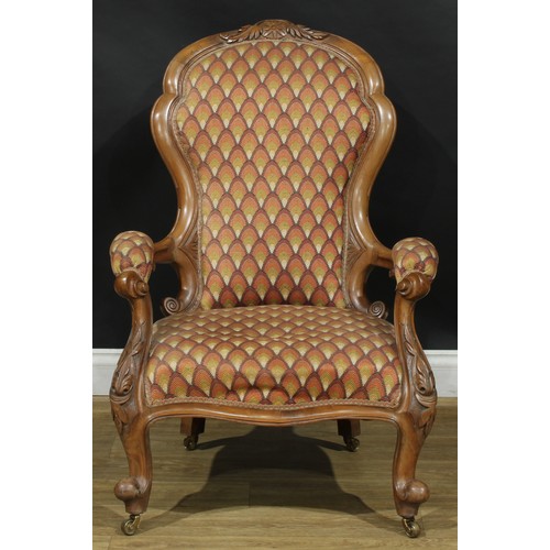 2537 - A pair of Victorian walnut drawing room chairs, stuffed-over upholstery, cabriole forelegs, brass ca... 