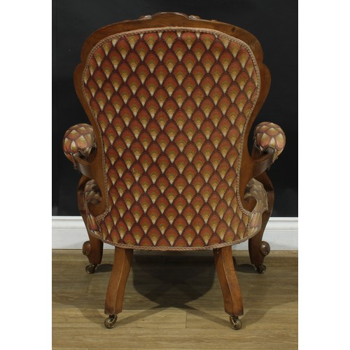 2537 - A pair of Victorian walnut drawing room chairs, stuffed-over upholstery, cabriole forelegs, brass ca... 