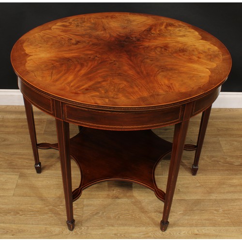 2696 - An Edwardian mahogany centre table, circular top with radiating flame veneers and parquetry edge abo... 