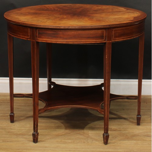 2696 - An Edwardian mahogany centre table, circular top with radiating flame veneers and parquetry edge abo... 