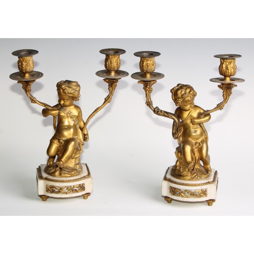 1814 - A pair of 19th century French bronze figural two-light candelabra, after Clodion (1738 - 1814), sign... 