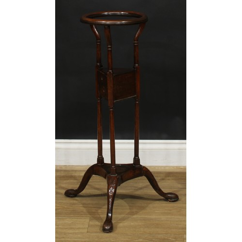 1710 - A 19th century mahogany wig stand, 79cm high, the top 26.5cm diameter