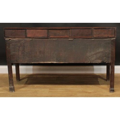 2042 - A George III vernacular oak low dresser, rectangular top applied with a row of five small drawers ab... 